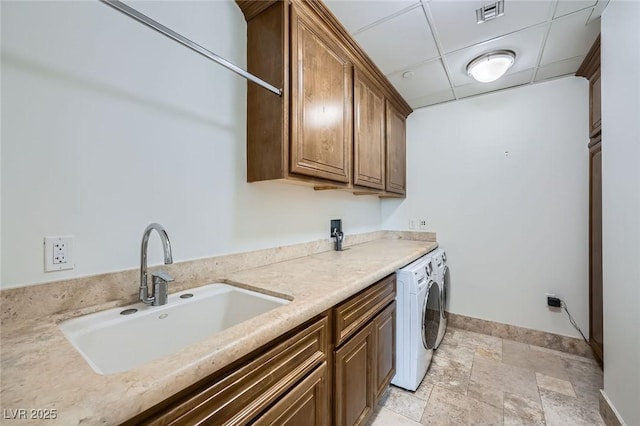9101 Alta Dr Unit 1203, Las Vegas, NV 89145 - washroom featuring cabinet space, baseboards, light stone finish floors, and independent washer and dryer