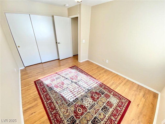 3372 Wayward Ct, Las Vegas, NV 89129 - unfurnished bedroom with wood finished floors and baseboards