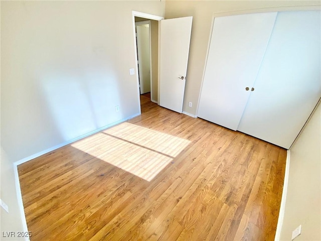3372 Wayward Ct, Las Vegas, NV 89129 - unfurnished bedroom with light wood-style floors, a closet, and baseboards