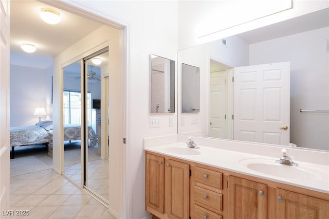 4970 Black Bear Rd Unit 101, Las Vegas, NV 89149 - bathroom with connected bathroom, double vanity, and tile patterned flooring
