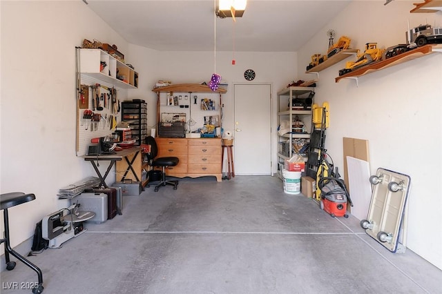 4970 Black Bear Rd Unit 101, Las Vegas, NV 89149 - garage with a workshop area and a garage door opener