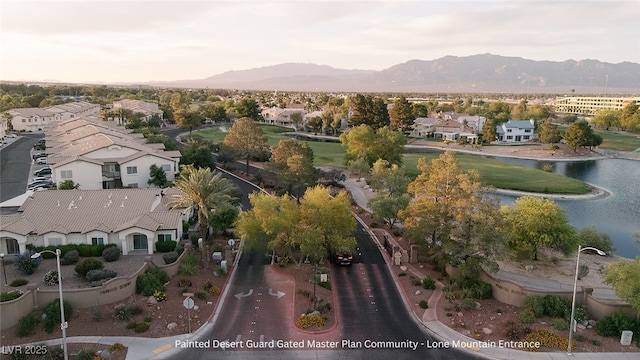4970 Black Bear Rd Unit 101, Las Vegas, NV 89149 - aerial perspective of suburban area with a water and mountain view