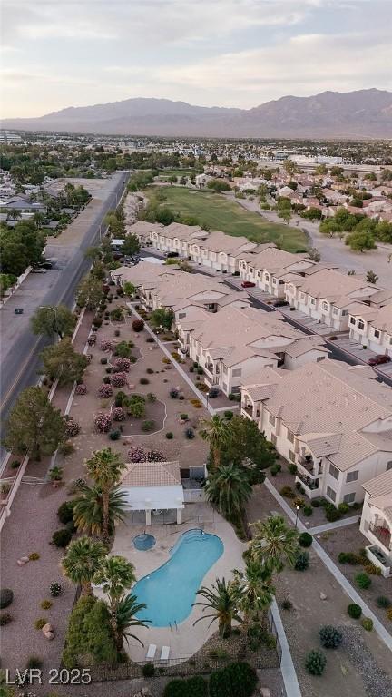 4970 Black Bear Rd Unit 101, Las Vegas, NV 89149 - aerial view of residential area with a mountain backdrop and a pool area