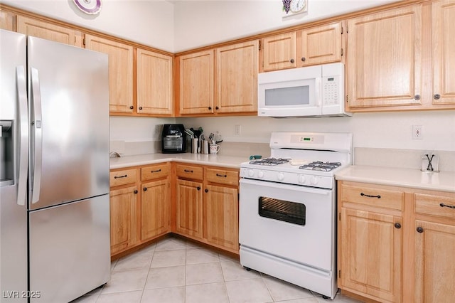 4970 Black Bear Rd Unit 101, Las Vegas, NV 89149 - kitchen featuring white appliances, light brown cabinets, light countertops, and light tile patterned flooring