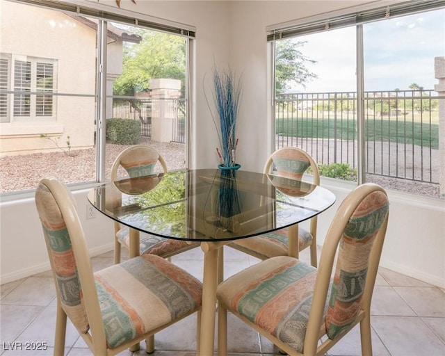 4970 Black Bear Rd Unit 101, Las Vegas, NV 89149 - dining area featuring light tile patterned floors, healthy amount of natural light, and baseboards