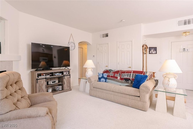 4970 Black Bear Rd Unit 101, Las Vegas, NV 89149 - carpeted living room featuring arched walkways