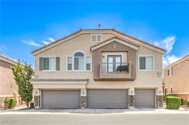8775 Traveling Breeze Ave Unit 102, Las Vegas, NV 89178 - multi unit property with a balcony, stucco siding, a garage, and stone siding