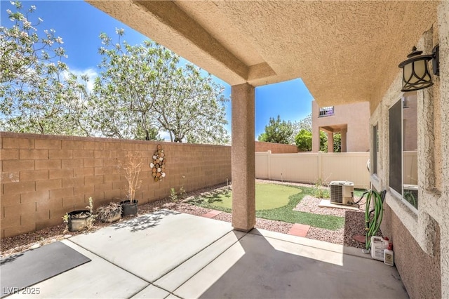 8775 Traveling Breeze Ave Unit 102, Las Vegas, NV 89178 - fenced backyard with a patio and central AC unit