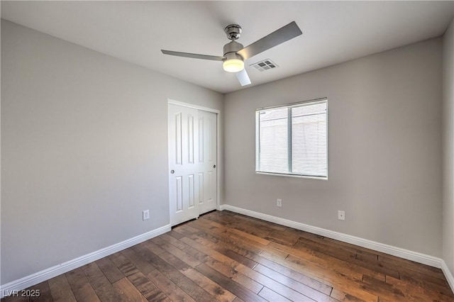8775 Traveling Breeze Ave Unit 102, Las Vegas, NV 89178 - unfurnished bedroom featuring dark wood finished floors and baseboards