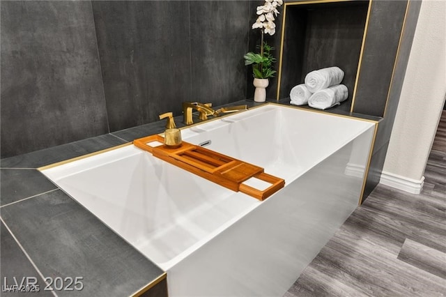 2407 Ridgeline Wash St, Las Vegas, NV 89138 - full bath with baseboards, a garden tub, and wood finished floors