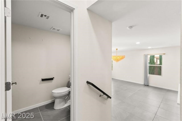 2407 Ridgeline Wash St, Las Vegas, NV 89138 - bathroom with toilet, tile patterned flooring, and baseboards