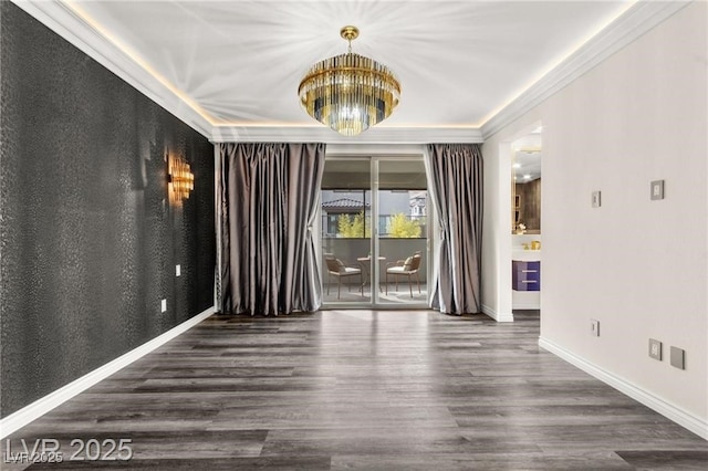 2407 Ridgeline Wash St, Las Vegas, NV 89138 - unfurnished room with a chandelier, wood finished floors, baseboards, and crown molding