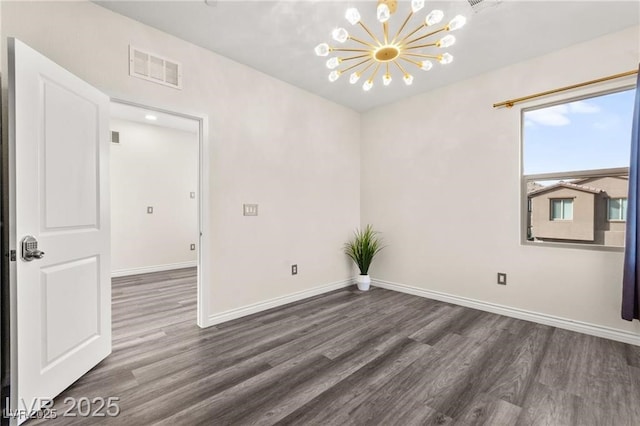 2407 Ridgeline Wash St, Las Vegas, NV 89138 - spare room featuring wood finished floors, a chandelier, and baseboards