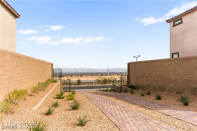 2407 Ridgeline Wash St, Las Vegas, NV 89138 - view of yard with a gate