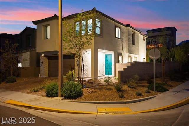 2407 Ridgeline Wash St, Las Vegas, NV 89138 - view of front of property featuring an attached garage and stucco siding