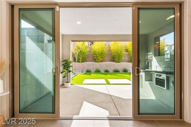 2407 Ridgeline Wash St, Las Vegas, NV 89138 - doorway to outside featuring tile patterned floors