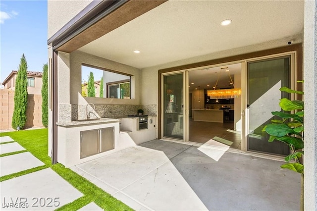 2407 Ridgeline Wash St, Las Vegas, NV 89138 - view of patio / terrace featuring area for grilling and a sink