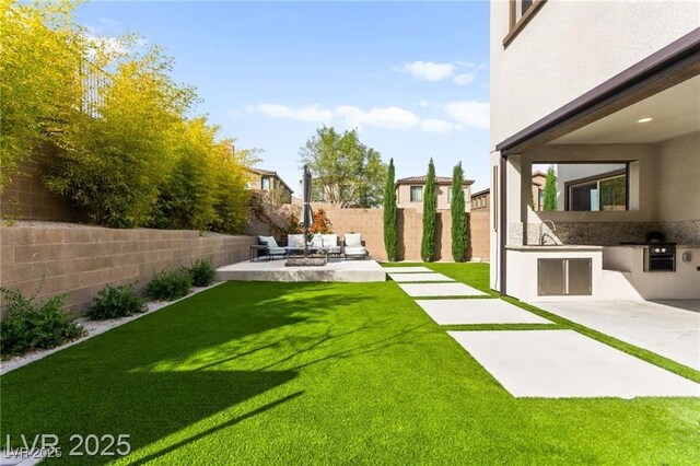 2407 Ridgeline Wash St, Las Vegas, NV 89138 - view of yard featuring area for grilling, a patio, and an outdoor living space