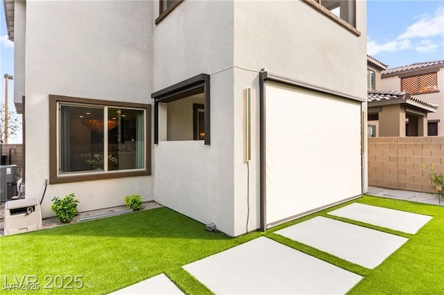 2407 Ridgeline Wash St, Las Vegas, NV 89138 - view of side of property with stucco siding and a patio