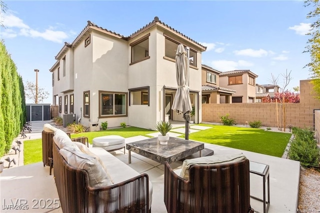 2407 Ridgeline Wash St, Las Vegas, NV 89138 - rear view of house with a patio area, stucco siding, an outdoor hangout area, and central AC unit