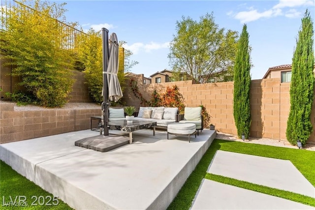 2407 Ridgeline Wash St, Las Vegas, NV 89138 - fenced backyard with an outdoor hangout area and a patio