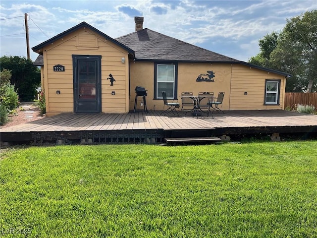 2228 Campton, Ely, NV 89301 - back of house with a chimney, roof with shingles, and a wooden deck