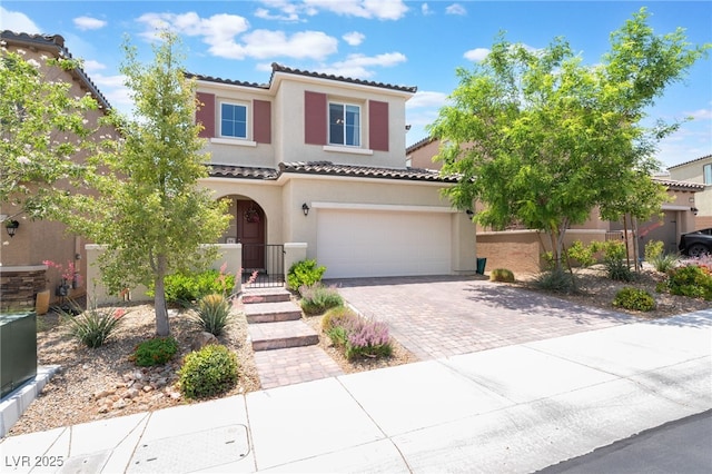 10829 Crestview Pointe Ave, Las Vegas, NV 89166 - mediterranean / spanish-style home featuring a tile roof, stucco siding, decorative driveway, and an attached garage