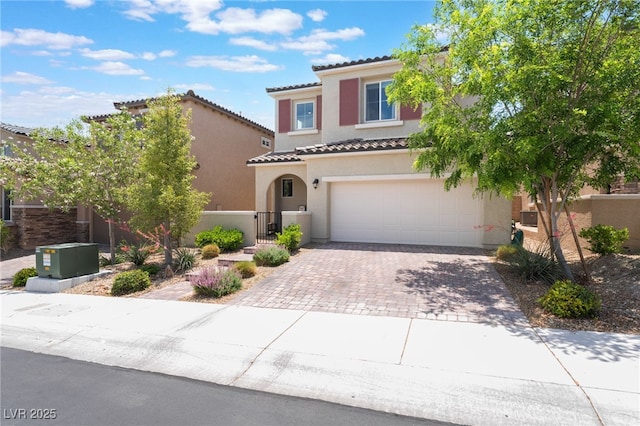 10829 Crestview Pointe Ave, Las Vegas, NV 89166 - mediterranean / spanish home featuring a tile roof, driveway, an attached garage, and stucco siding