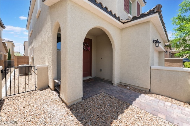 10829 Crestview Pointe Ave, Las Vegas, NV 89166 - entrance to property featuring stucco siding, a gate, and a tile roof