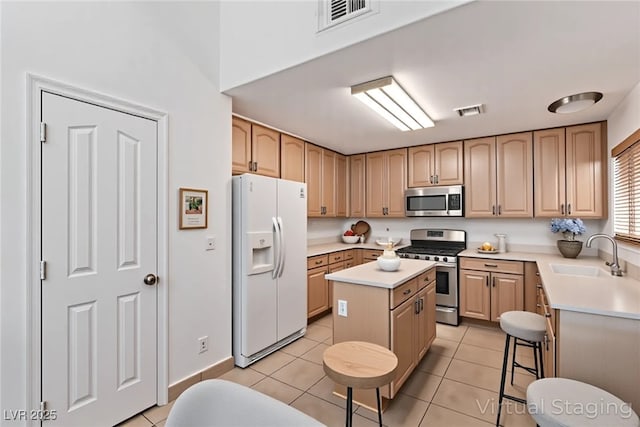 2037 Merano Ct, Las Vegas, NV 89123 - kitchen with stainless steel appliances, a sink, a center island, and light countertops
