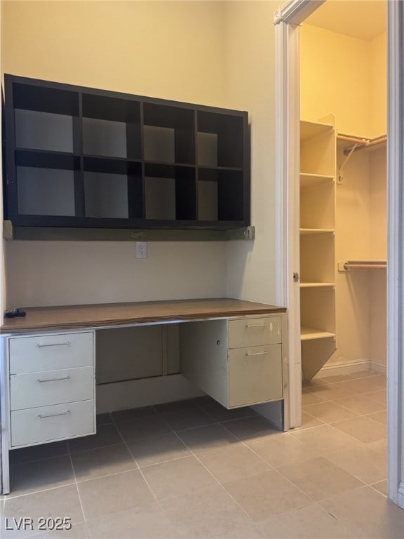 7934 Cape Flattery Ave, Las Vegas, NV 89147 - unfurnished office with light tile patterned flooring and built in desk