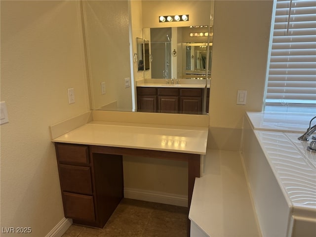 7934 Cape Flattery Ave, Las Vegas, NV 89147 - full bathroom with a shower stall, vanity, baseboards, and tile patterned flooring