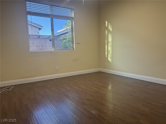 7934 Cape Flattery Ave, Las Vegas, NV 89147 - unfurnished room featuring dark wood-style floors and baseboards
