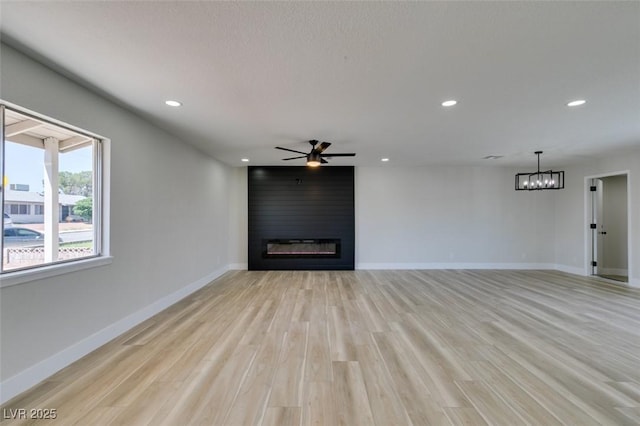 6100 Fawn Cir, Las Vegas, NV 89107 - unfurnished living room with a fireplace, a ceiling fan, recessed lighting, light wood finished floors, and baseboards