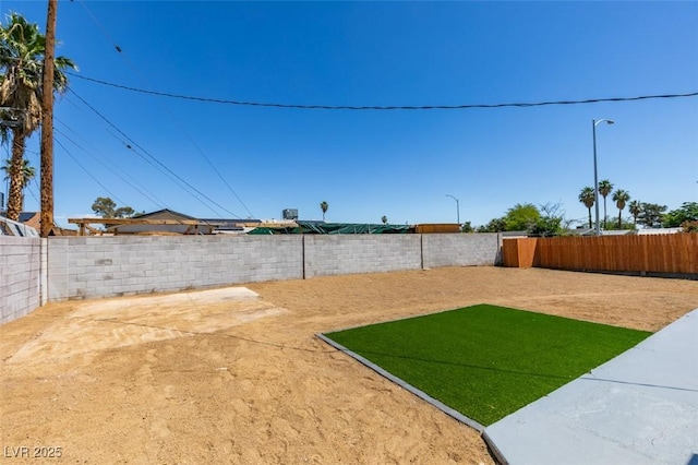 6100 Fawn Cir, Las Vegas, NV 89107 - fenced backyard with a patio