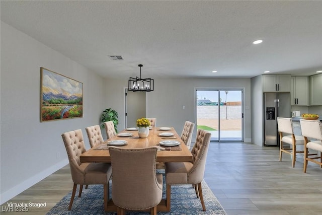 6100 Fawn Cir, Las Vegas, NV 89107 - dining space featuring recessed lighting, a chandelier, light wood-style floors, and baseboards