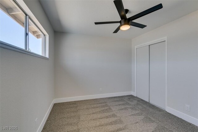 6100 Fawn Cir, Las Vegas, NV 89107 - unfurnished bedroom featuring carpet floors, baseboards, a closet, and ceiling fan