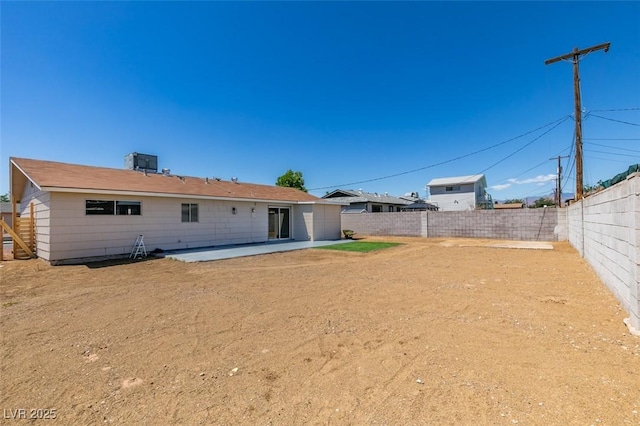 6100 Fawn Cir, Las Vegas, NV 89107 - back of house with a fenced backyard, a patio area, and central AC