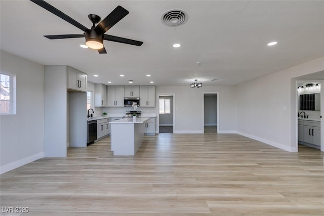 4360 El Tovar Rd, Las Vegas, NV 89115 - kitchen featuring appliances with stainless steel finishes, open floor plan, baseboards, light countertops, and recessed lighting