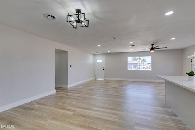 4360 El Tovar Rd, Las Vegas, NV 89115 - unfurnished living room with recessed lighting, ceiling fan, light wood finished floors, and baseboards