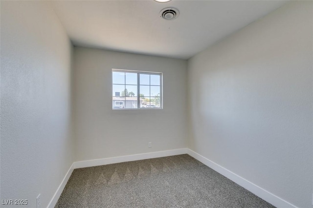 4360 El Tovar Rd, Las Vegas, NV 89115 - empty room featuring dark colored carpet and baseboards