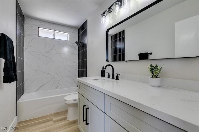 4360 El Tovar Rd, Las Vegas, NV 89115 - full bath with vanity, toilet, shower / washtub combination, and wood finished floors