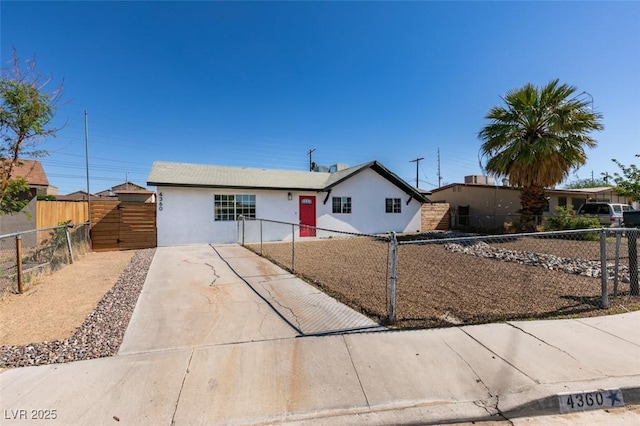 4360 El Tovar Rd, Las Vegas, NV 89115 - ranch-style house featuring stucco siding, driveway, and a fenced front yard
