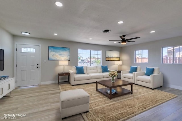 4360 El Tovar Rd, Las Vegas, NV 89115 - living area with healthy amount of natural light, ceiling fan, baseboards, recessed lighting, and light wood-type flooring