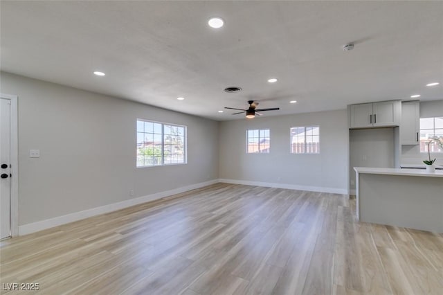 4360 El Tovar Rd, Las Vegas, NV 89115 - unfurnished living room featuring recessed lighting, ceiling fan, baseboards, and light wood-style flooring