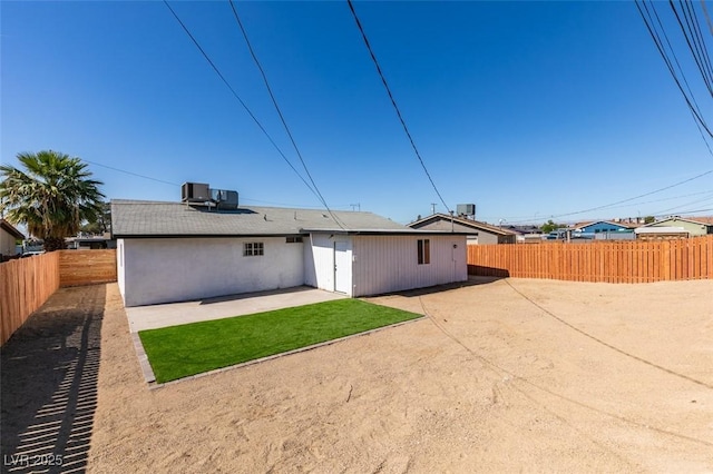 4360 El Tovar Rd, Las Vegas, NV 89115 - back of house with a patio, a fenced backyard, and central air condition unit