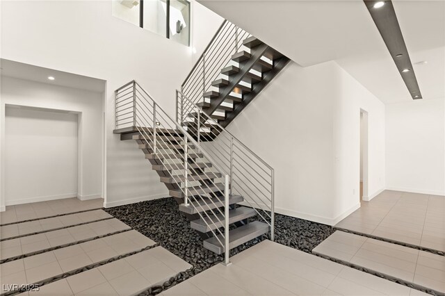 25 Canyon Bay Dr, Henderson, NV 89011 - stairs featuring recessed lighting, baseboards, tile patterned floors, and inlaid floor details