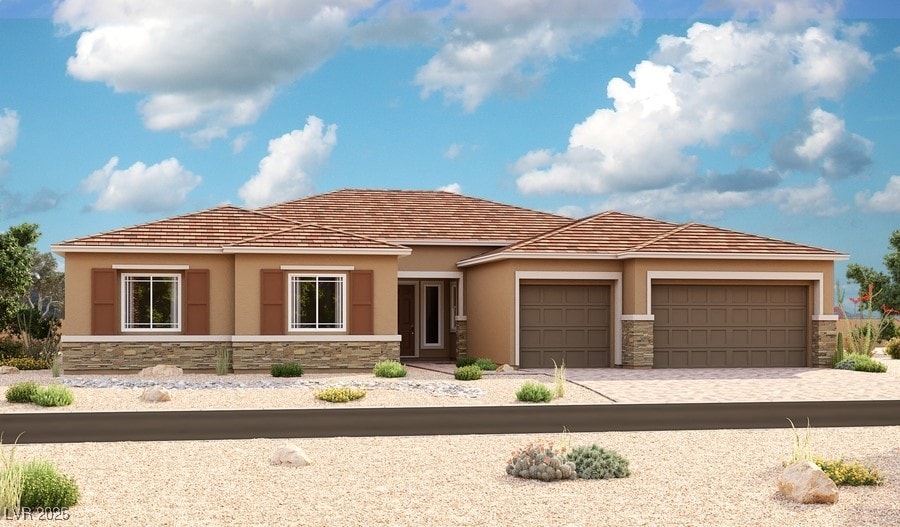 9870 Amati Ave, Las Vegas, NV 89149 - view of front of house featuring stone siding, stucco siding, a garage, and decorative driveway