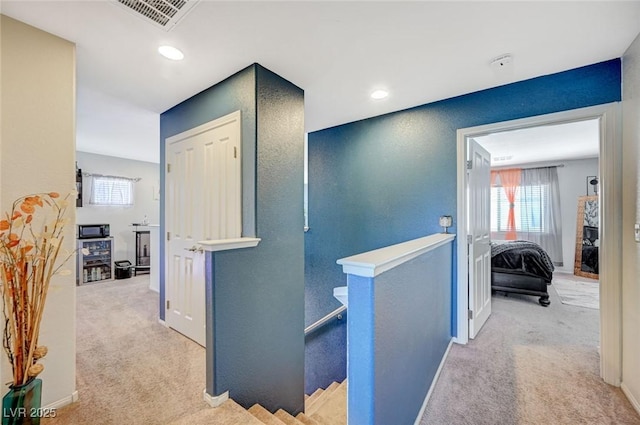 1413 Miller Ridge Ave, North Las Vegas, NV 89031 - hallway featuring an upstairs landing, carpet floors, and baseboards