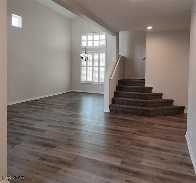 5509 Big Sky Ln, Las Vegas, NV 89149 - staircase with a chandelier, plenty of natural light, wood finished floors, recessed lighting, and baseboards